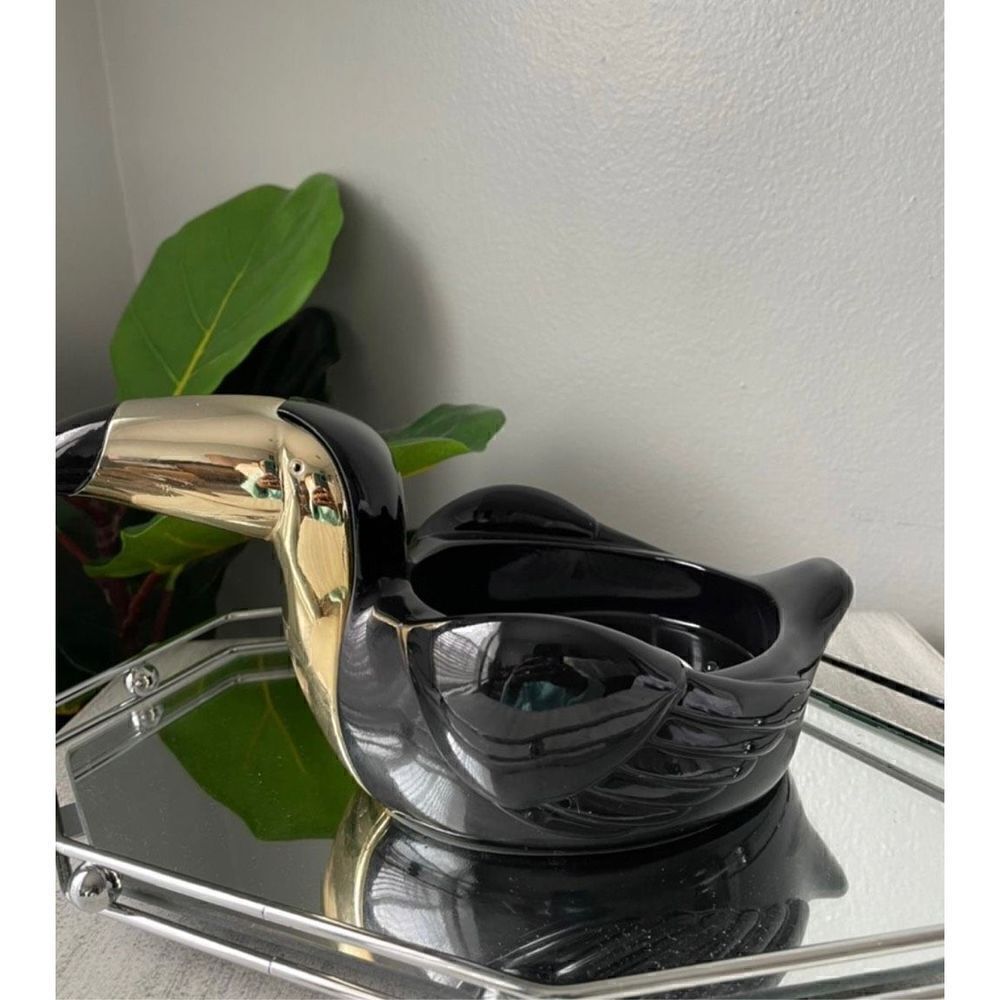 Toucan bird bath and body work candle holder